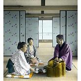Japan. Man and Two Women Having Tea Inside Room.