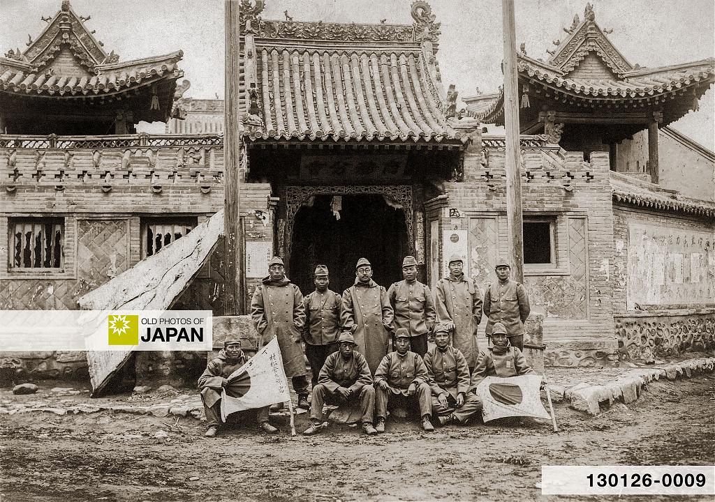 Japanese soldiers with yosegaki hinomaru in front of a Chinese temple in Manchuria, ca. 1930s, 1940s