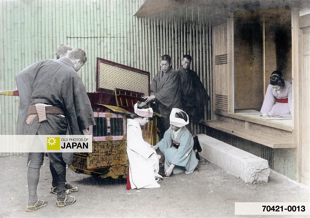 A Japanese bride arrives at the groom’s house in a palanquin during an arranged marriage, 1905