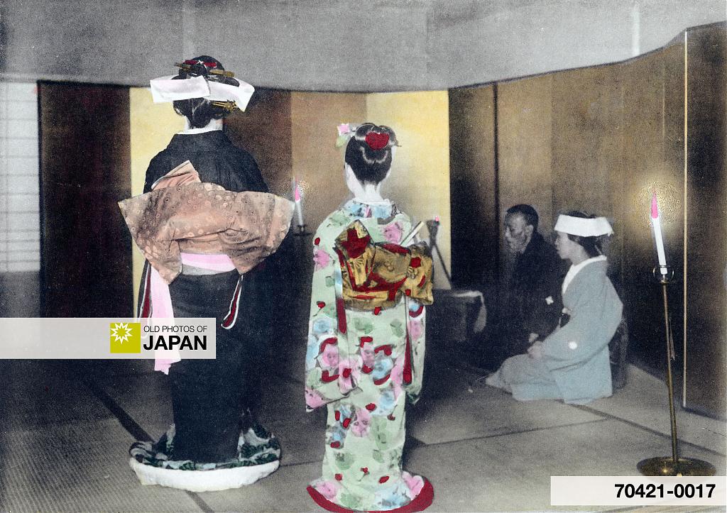 A Japanese bride and her bridesmaid enter the family room, 1905
