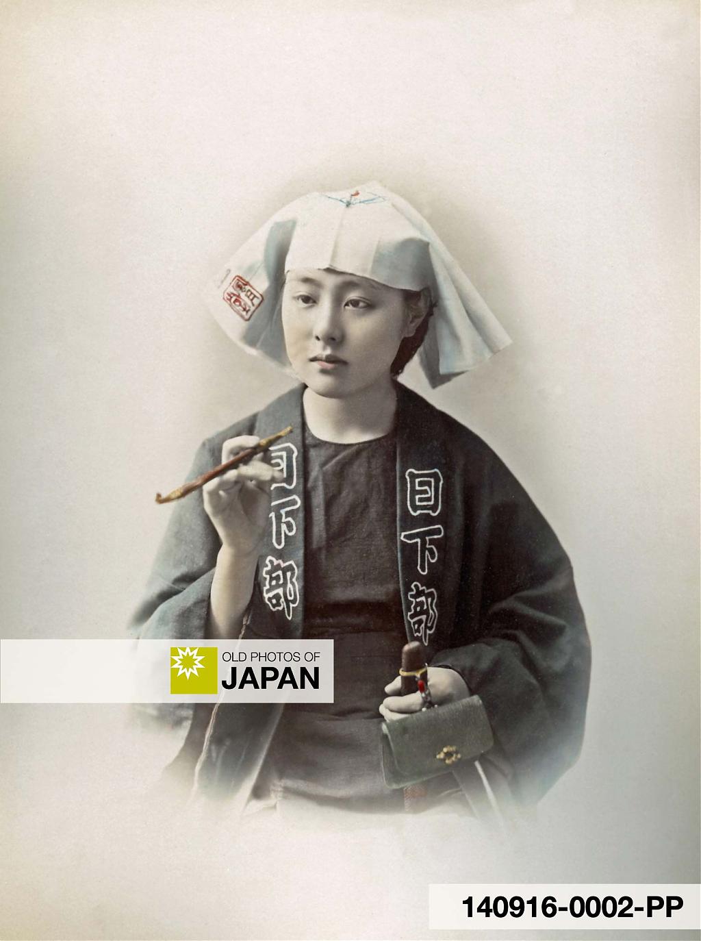 140916-0002-PP - A young Japanese woman dressed as a young man holding a kiseru pipe, 1890s