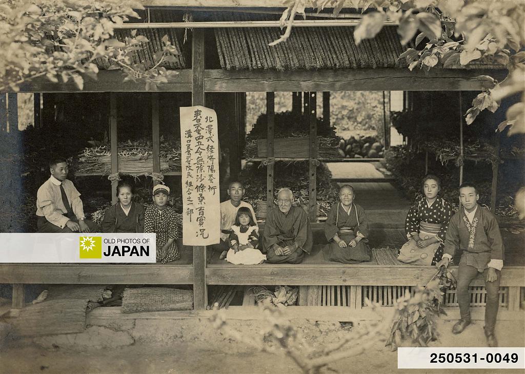 Japanese silk farming family posing at home, ca. 1920s