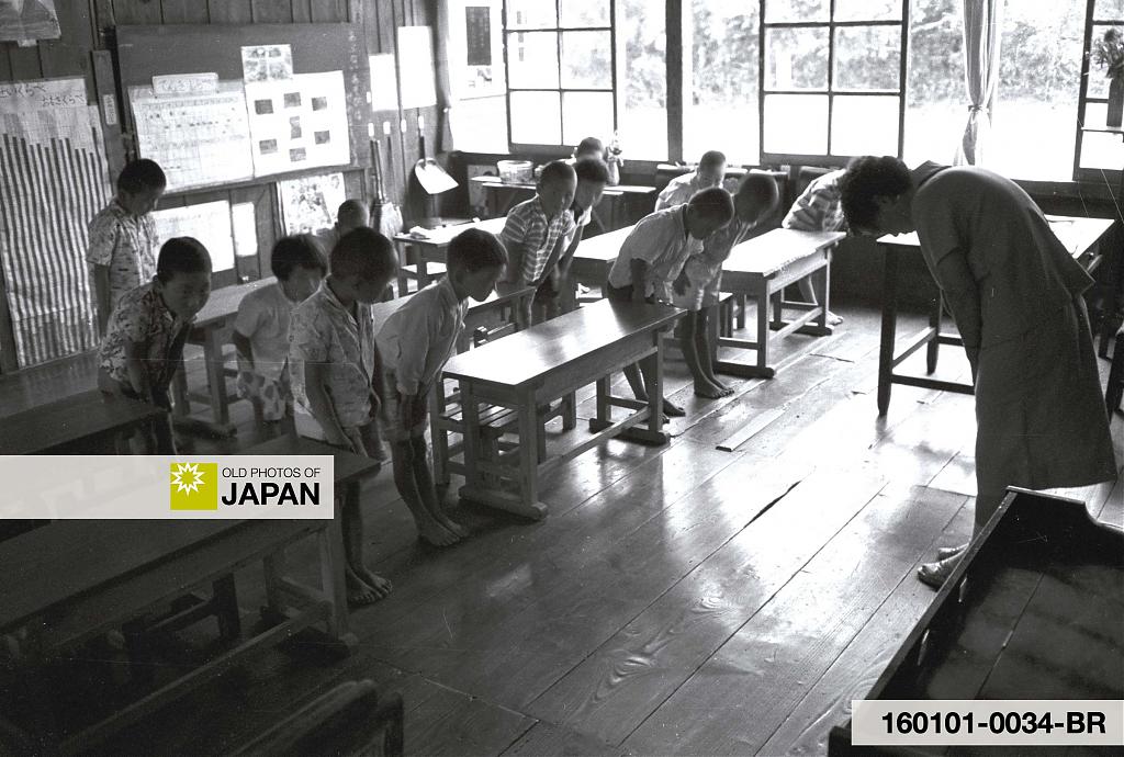 Children and a teacher bow to each other, 1960