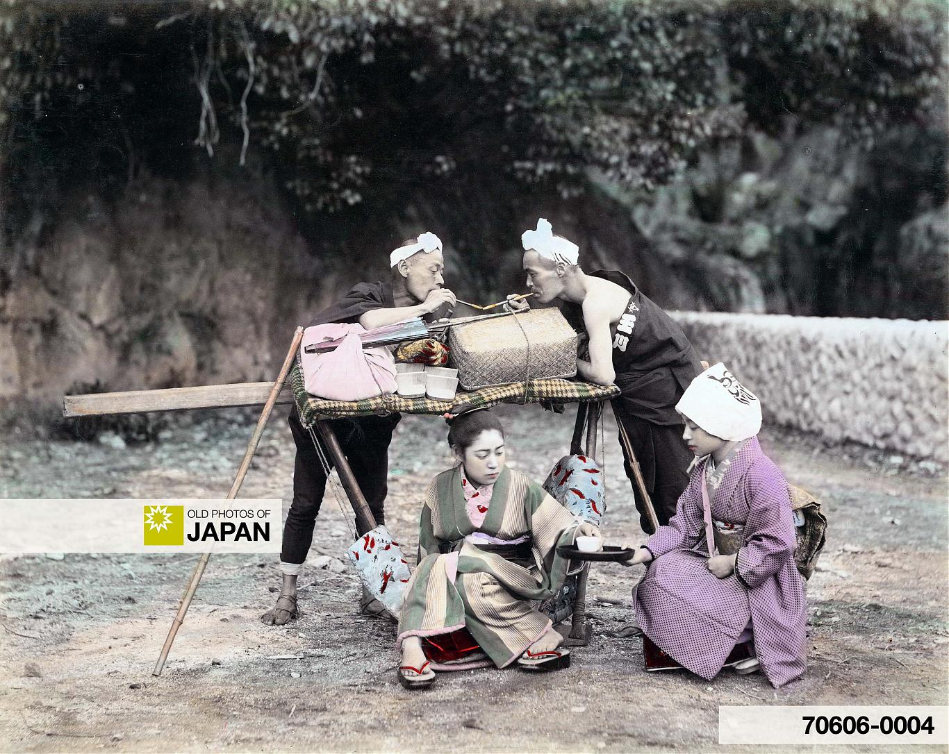 70606-0004 - Two Japanese kago bearers are taking a break and getting a smoke, ca. 1890s