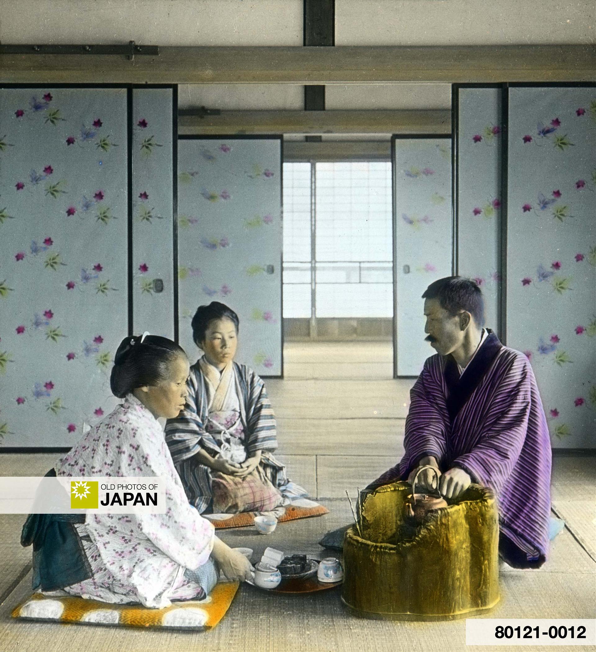 80121-0012 - A Japanese Man and Two Women Having Tea Inside a Room, 1930