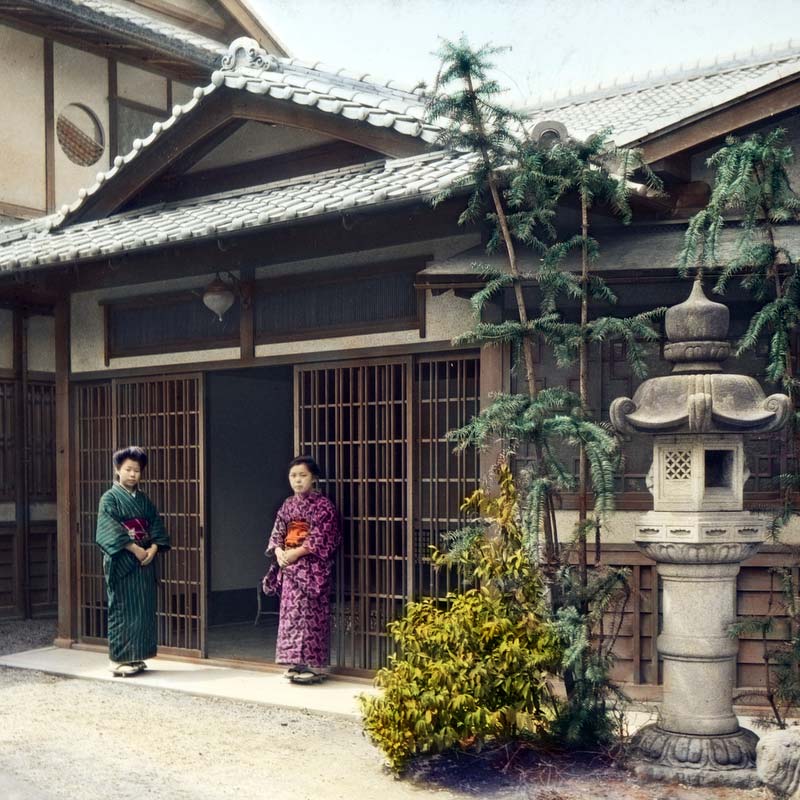 80121-0001 - Two women standing at the entrance of a Japanese dwelling, 1924