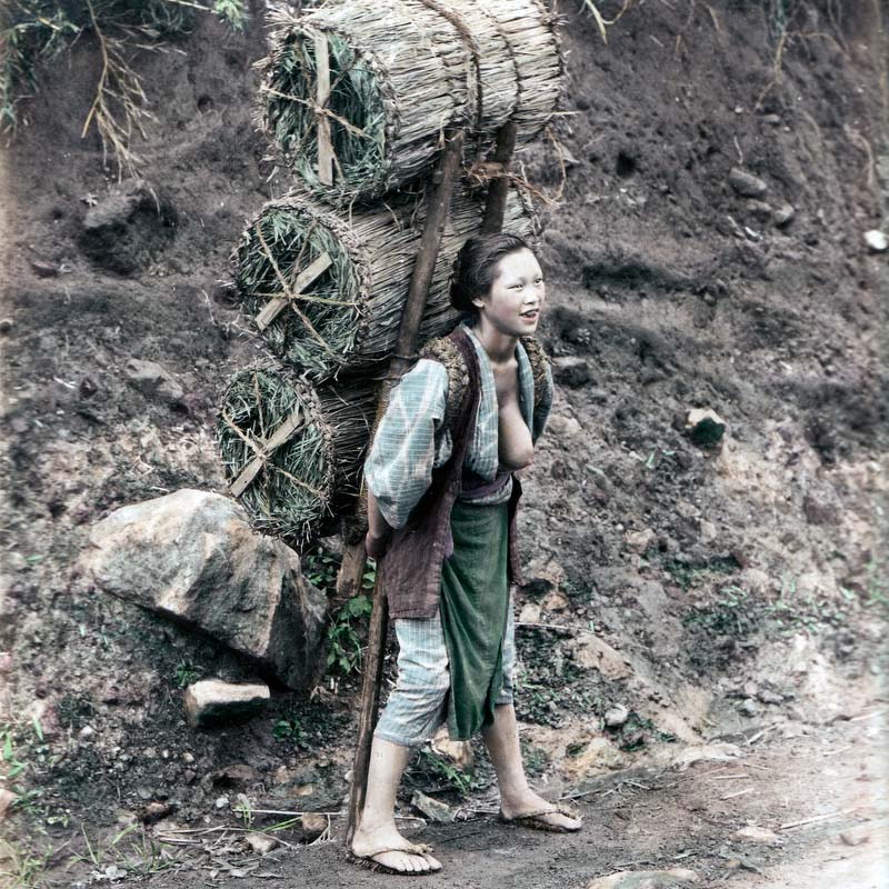 80129-0009 - Japanese woman carrying charcoal, 1890s